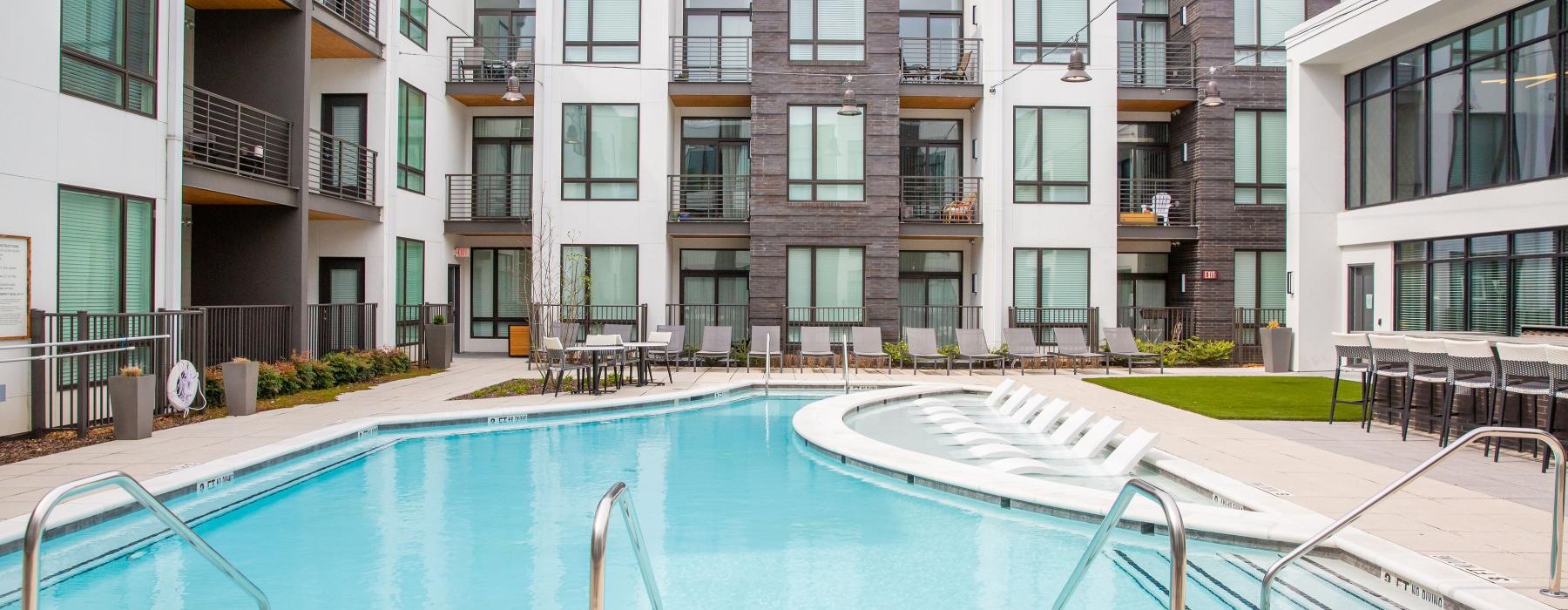 a swimming pool in front of a building