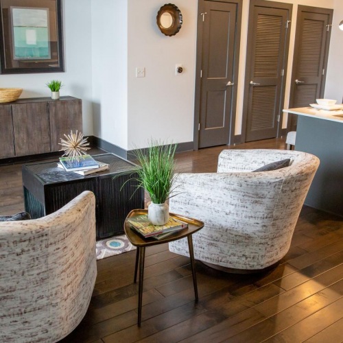 Refined spaces to match your style a living room with a wood floor